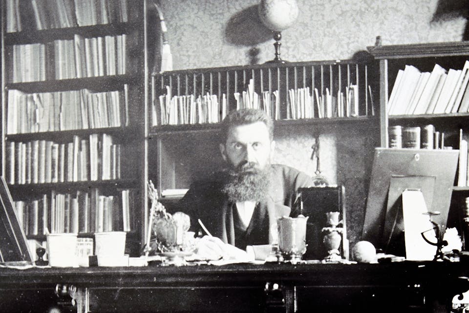 Theodor Herzl at his desk in Vienna around 1900. *Imagno/Getty Images*. Herzl LW Main