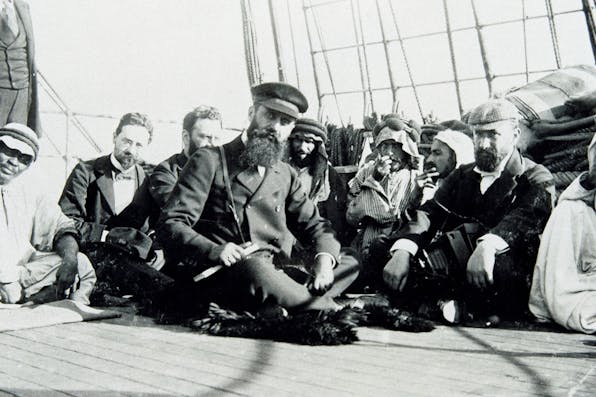 Theodor Herzl on board the Imperator Nikolaus II in 1898 with (from left to right) Max Bodenheimer, Moritz Schnirer und David Wolffsohn. *Imagno/Getty Images*. Herzl 2 Main