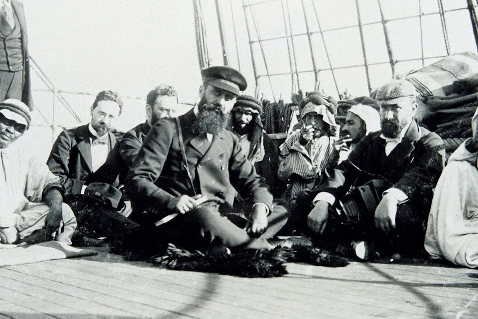 Theodor Herzl on board the Imperator Nikolaus II in 1898 with (from left to right) Max Bodenheimer, Moritz Schnirer und David Wolffsohn. *Imagno/Getty Images*. Herzl 2 Main