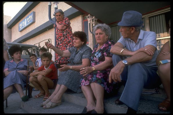 Russian immigrants to Israel temporarily housed in a hotel in 1989. *David Rubinger/The LIFE Images Collection via Getty Images/Getty Images.* Sharansky Troy Russians Main