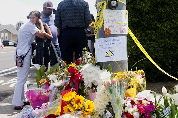 Mourners and well wishers leave flowers and signs at a memorial across the street from the Chabad of Poway Synagogue on Sunday, April 28, 2019 in Poway, California, one day after a teenage gunman opened fire, killing one person and injuring three others. *SANDY HUFFAKER/AFP via Getty Images*. Weiss Response Main