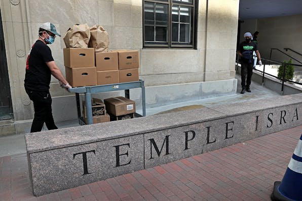 A team prepares meals at the Temple Israel synagogue kitchen in Boston on Sept. 1, 2020. *David L. Ryan/The Boston Globe via Getty Images.* Carmy Gordis Main