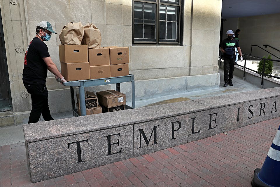 A team prepares meals at the Temple Israel synagogue kitchen in Boston on Sept. 1, 2020. *David L. Ryan/The Boston Globe via Getty Images.* Carmy Gordis Main