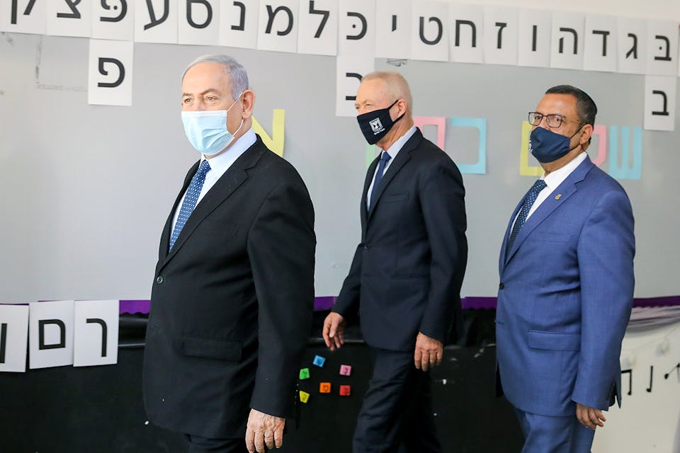 Israeli Prime Minister Benjamin Netanyahu and Minister of Education Yoav Galant visit at a school in Jerusalem ahead of the opening of the school year on August 25, 2020. *Marc Israel Sellem/POOL*. Gordon Response Gur