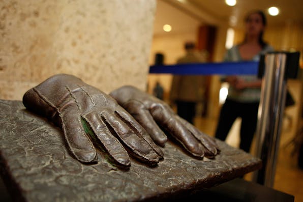 A replica of the gloves that were used by an Israeli Mossad agent during the capturing of Adolf Eichmann in Argentina in 1960 displayed at an exhibition at the Knesset in Jerusalem on December 12, 2011. *GALI TIBBON/AFP via Getty Images.* Eichmann Gloves Main
