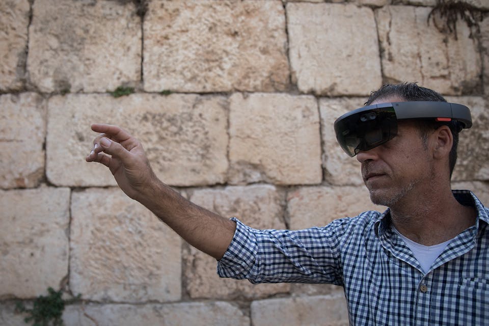 A man looking through augmented reality glasses at the Tower of David Museum in Jerusalem’s Old City on October 17, 2017. *Hadas Parush/Flash90*. Virtual Reality Main