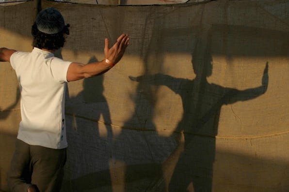 *A religious Israeli man practicing a kabbalistic form of yoga.* GALI TIBBON/AFP via Getty Images. Yoga Israel Home