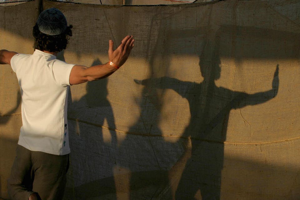 *A religious Israeli man practicing a kabbalistic form of yoga.* GALI TIBBON/AFP via Getty Images. Yoga Israel Home