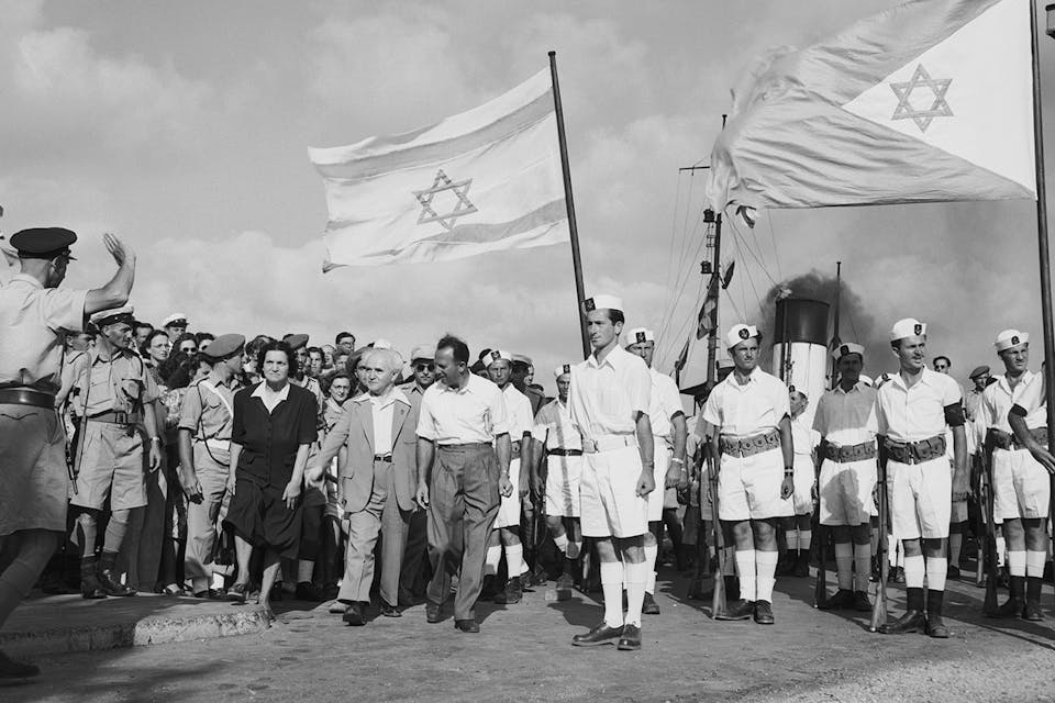 *David Ben-Gurion with his wife and others at the Haifa docks to see the last contingent of British troops leave Israel on July 4, 1948. *Bettmann/Getty. Kramer BG Last Word Main