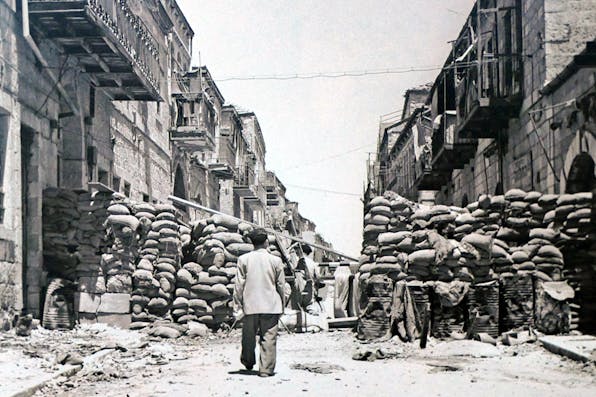 *A barricaded street during the Israeli War of Independence in 1948*. Universal History Archive/ Universal Images Group via Getty Images. Eliot Cohen Kramer Main