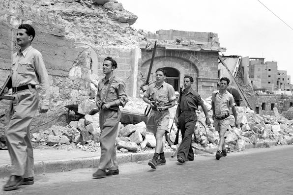 *Haganah troops patrolling after the capture of Haifa in 1948*. Bettmann via Getty. Morris Kramer IDF Main