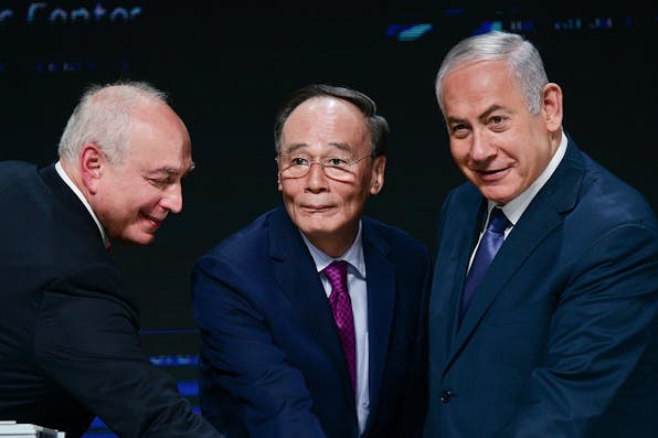 *Chemi Peres, Wang Qishan, vice president of China, and Benjamin Netanyahu in Tel Aviv on October 25, 2018.* Tomer Neuberg/Flash90. China Lerman Main