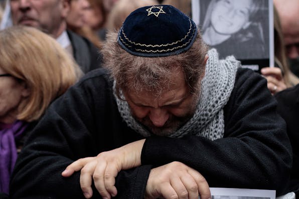 *A man at an AMIA memorial in July 2019 in Buenos Aires, Argentina.* Federico Rotter/NurPhoto via Getty Images. AMIA Memorial 2 Main