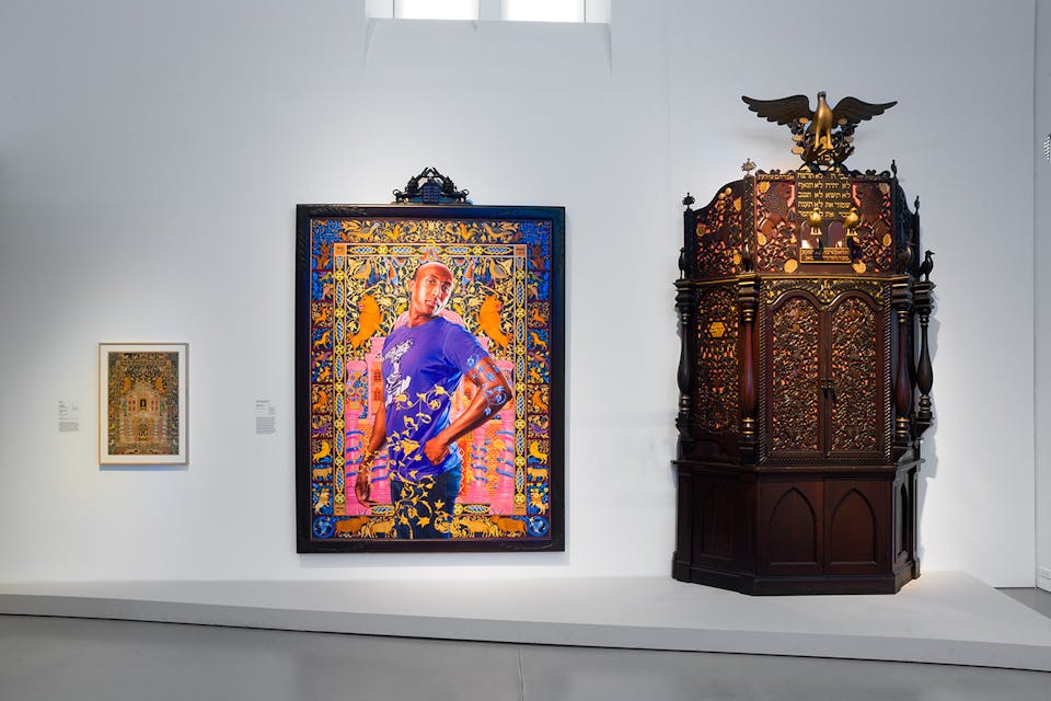*An 1877 Ukrainian mizraḥ, Kehinde Wiley’s painting of Alios Itzhak, and an ark from Iowa.* Jewish Museum. Wiley Scene