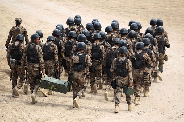 *Members of the Iraqi Counter-Terrorism Service (CTS) take part in a training drill at the Special Forces Academy near Baghdad’s international airport on March 19, 2018 as Iraq marks the 15th anniversary of the U.S. invasion.* AHMAD AL-RUBAYE/AFP/Getty Images. Cook Doran Main
