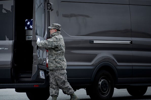 *A member of the Air Force secures the remains of Scott A. Wirtz, a Defense Intelligence Agency civilian and former Navy Seal killed in a suicide bombing in Syria*. BRENDAN SMIALOWSKI/AFP/Getty Images. Kramer Doran Syria Main