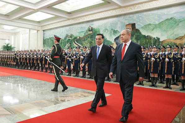 Chinese Premier Li Keqiang accompanies Israel Prime Minister Benjamin Netanyahu at a welcoming ceremony in Beijing on March 20, 2017. (Lintao Zhang/Getty Images) Abrams Herman