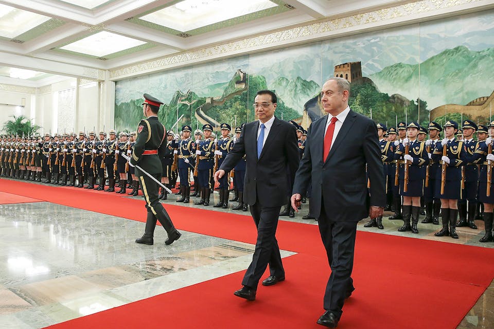 Chinese Premier Li Keqiang accompanies Israel Prime Minister Benjamin Netanyahu at a welcoming ceremony in Beijing on March 20, 2017. (Lintao Zhang/Getty Images) Abrams Herman