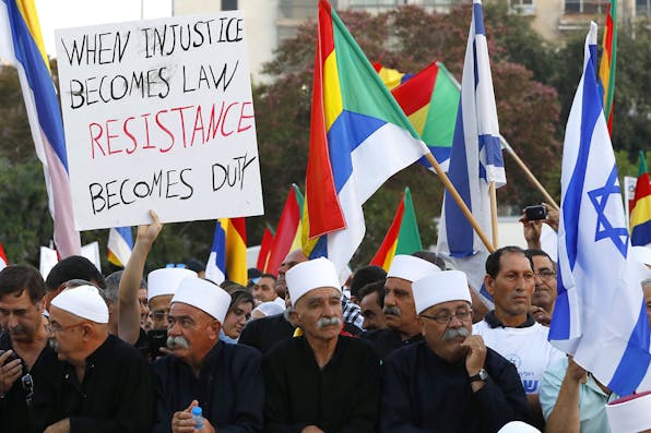 *Members of the Israeli Druze community and their supporters protest against the new nation-state law in Tel Aviv.* JACK GUEZ/AFP/Getty Images. Wilf Mor Main