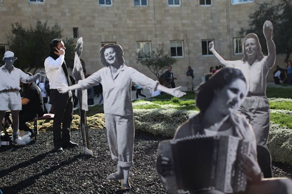 *Israelis prepare a 2011 ceremony reconstructing the celebrations that took place on November 29, 1947 following passage of the UN partition plan for Palestine, which led to the creation of the state of Israel.* MENAHEM KAHANA/AFP/Getty Images. 1947 Reenactment