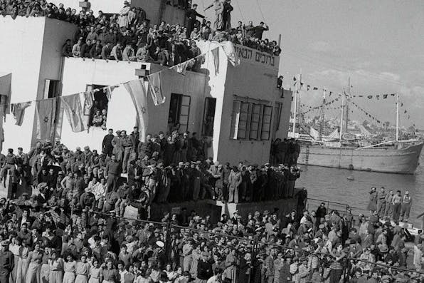 *The *SS Atzmaut* docks in Haifa in 1949 carrying Jewish refugees from Eastern Europe.* Eldan David/Government Press Office of Israel. Mandelbaum Main