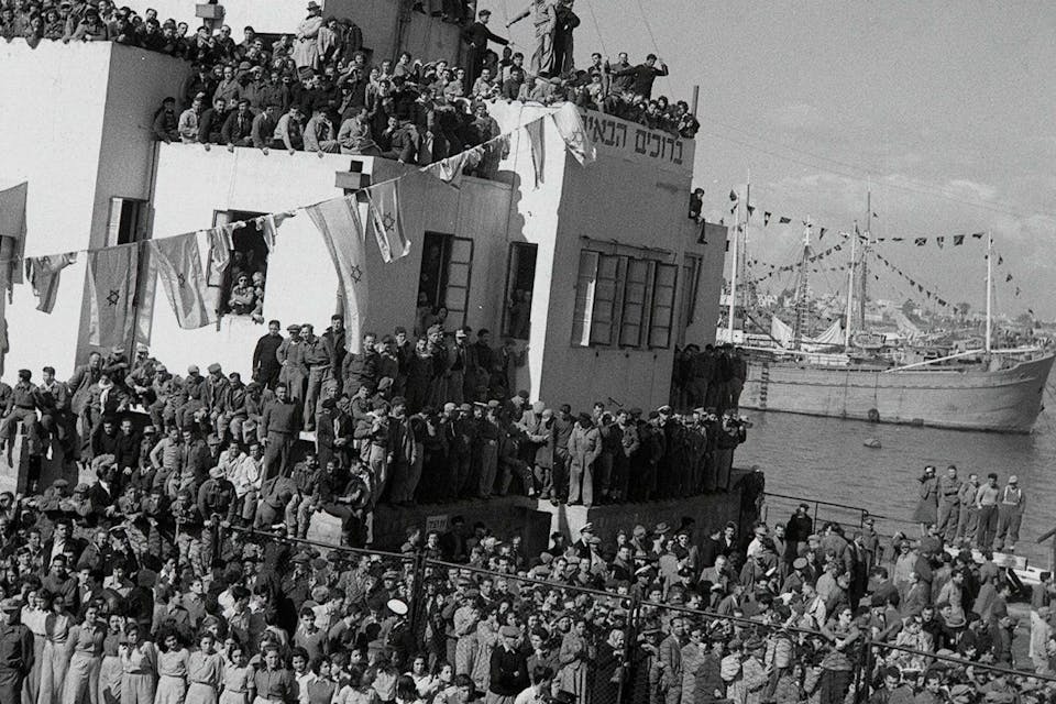 *The *SS Atzmaut* docks in Haifa in 1949 carrying Jewish refugees from Eastern Europe.* Eldan David/Government Press Office of Israel. Mandelbaum Main