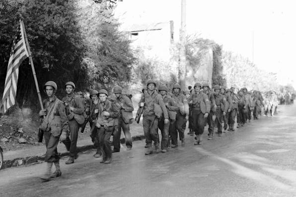*American infantry marching through Algiers after landing during Operation Torch in 1942.* Bettmann. D PJ North Africa