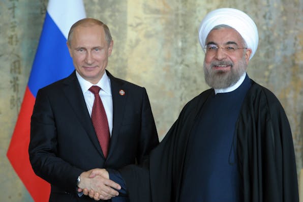 *Russian president Vladimir Putin with Iranian president Hassan Rouhani in Shanghai on May 21, 2014.* ALEXEY DRUZHININ/AFP/Getty Images. Kagan Main
