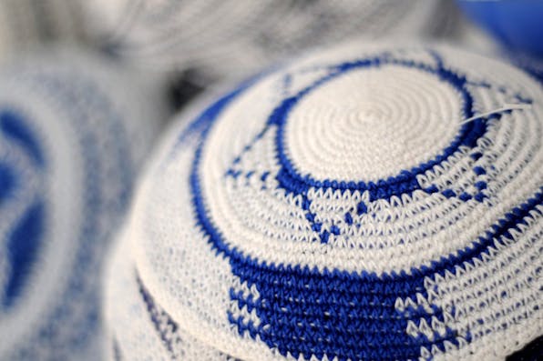 *Knitted kippot at the Mahane Yehuda Market in Jerusalem.* Sophie Gordon / Flash90. kippah-main