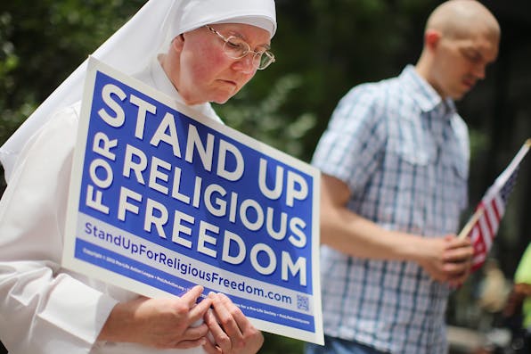 *A nun at a rally with other supporters of religious freedom in Chicago, 2014*. Scott Olson/Getty Images. berko-rl-main