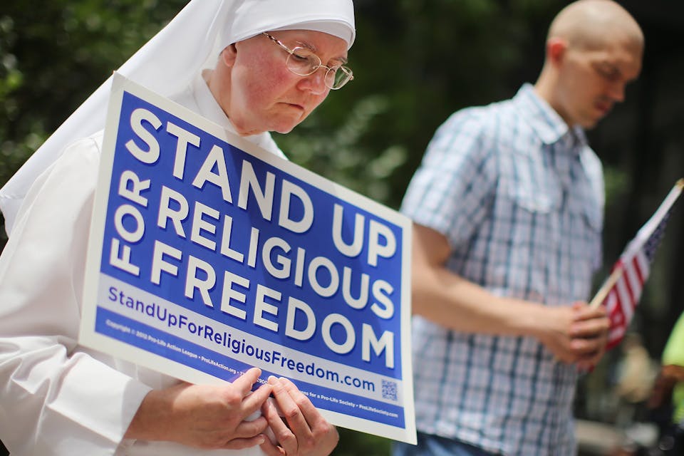 *A nun at a rally with other supporters of religious freedom in Chicago, 2014*. Scott Olson/Getty Images. berko-rl-main