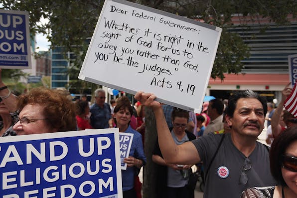 *Protesters at a religious freedom rally on June 8, 2012 in Miami, Florida.* Joe Raedle/Getty Images. mcclay-main