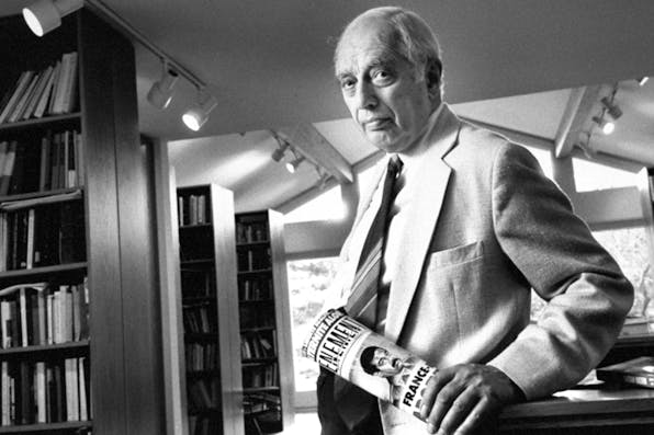 Bernard Lewis standing in his study holding a French newspaper in 1990. *Marianne Barcellona/The LIFE Images Collection/Getty Images.* Lewis-Main