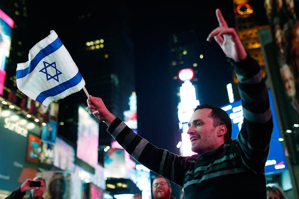 *A pro-Israel supporter in New York City’s Times Square, November 21, 2012.* REUTERS/Carlo Allegri. TS-Israel