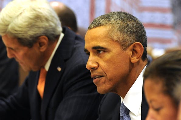 *President Barack Obama and Secretary of State John Kerry at the UN General Assembly in New York on September 28, 2015.* Russian Presidential Press and Information Office/Anadolu Agency/Getty Images. Obama-LW