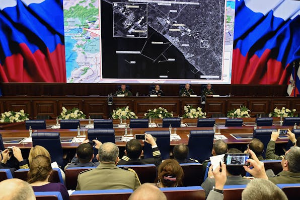 *Russia’s top military officials hold a press conference on the fight against terrorism in Syria at the National Defence Control Centre of the Russian Federation in Moscow on December 2, 2015.* VASILY MAXIMOV/AFP/Getty Images. Ross-Main