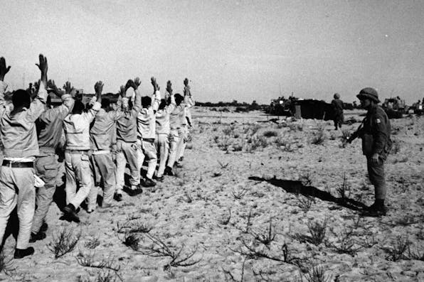 *Egyptian prisoners and Israeli soldiers in the Sinai during the Six-Day War in June 1967 in Egypt.* Fondation Gilles CARON/Gamma-Rapho via Getty Images. Kramer-Final-Main