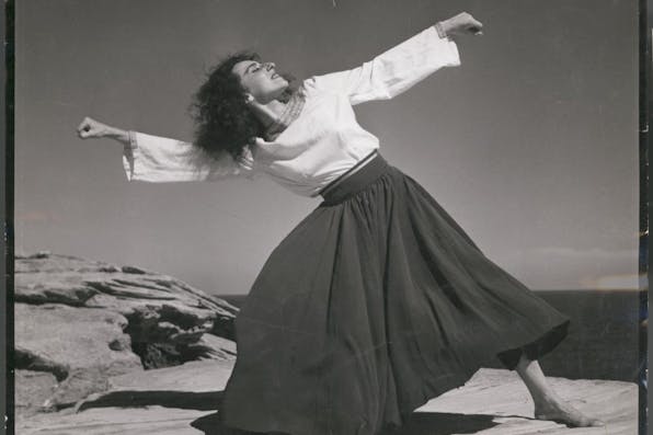 *A woman performing the hora at the Israeli seaside in 1951.*State Library of Victoria, Australia. 702825003