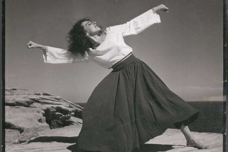 *A woman performing the hora at the Israeli seaside in 1951.*State Library of Victoria, Australia. 702825003
