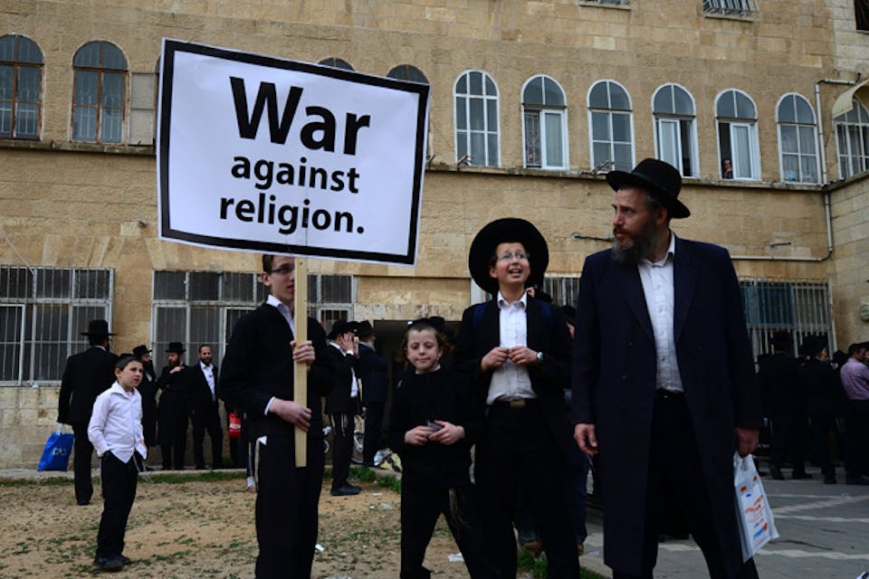 Haredi *Jews protest a military draft bill on March 2, 2014 in Jerusalem.* Photo by Salih Zeki Fazlioglu/Anadolu Agency/Getty Images. BerkoHomeandMain