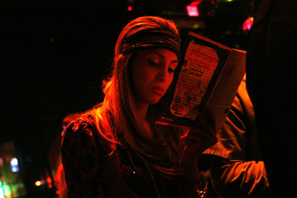 *A woman at a Purim party at a club in New York.* Kitra Cahana/Getty Images. Difference-Main