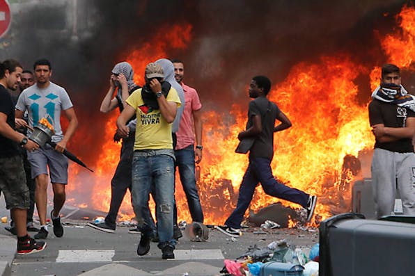 *Rioters, some of whom burned several Jewish-owned stores, face police in a Paris suburb on July 20, 2014.* AP Photo/Thibault Camus Gurfinkiel-Response