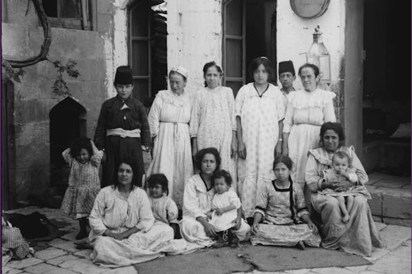 *A poor Jewish family of Aleppo in the early 20th century.* Library of Congress. jewsinaleppobig