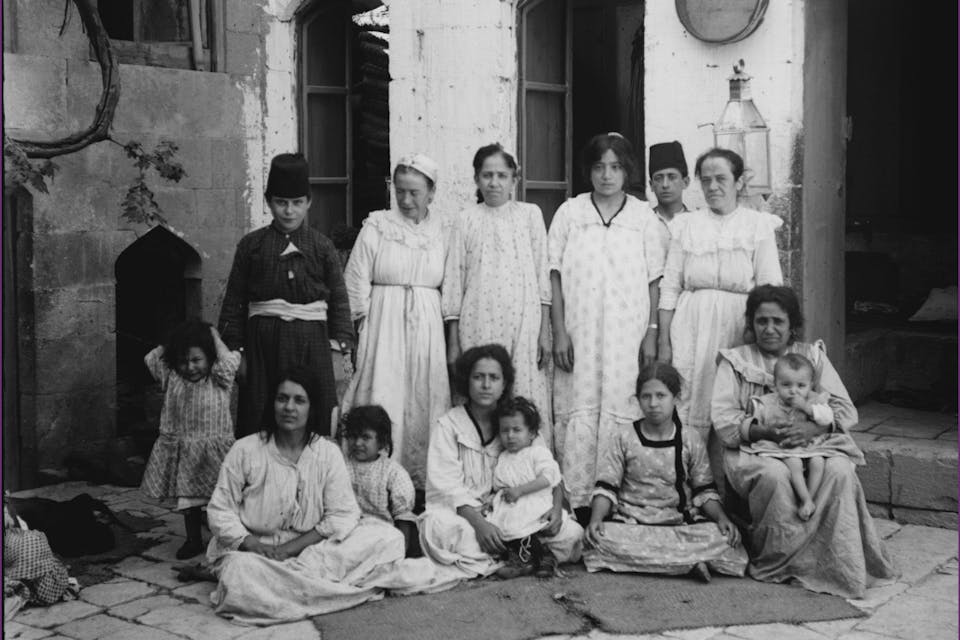 *A poor Jewish family of Aleppo in the early 20th century.* Library of Congress. jewsinaleppobig