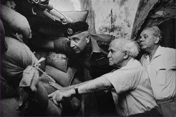 *David Ben-Gurion with IDF Commander Yossef Nevo and Mayor of Jerusalem Mordechai Ish-Shalom at an army post at the Jerusalem border, 1962.* By David Harris. bengurion