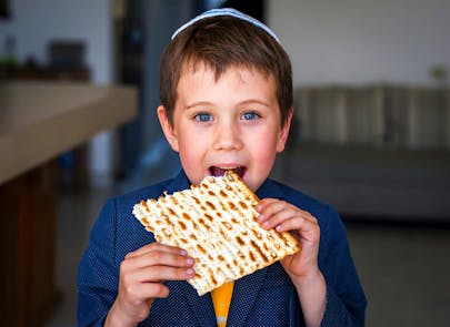 Cute,Caucasian,Child,In,A,Yarmulke,Taking,A,Bite,From Cute,Caucasian,Child,In,A,Yarmulke,Taking,A,Bite,From
