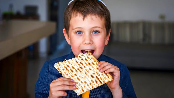 Cute,Caucasian,Child,In,A,Yarmulke,Taking,A,Bite,From Cute,Caucasian,Child,In,A,Yarmulke,Taking,A,Bite,From