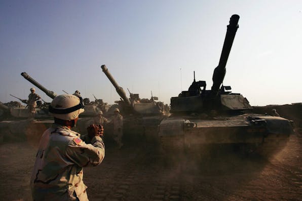 U.S. tanks preparing for the assault on Fallujah, November 4, 2004. *Scott Nelson via Getty Images*. FALLUJA, IRAQ – NOVEMBER 4:  U.S. Army tanks are moved into a base, on November 4, 2004 on the outskirts of Falluja, Iraq. Several thousand U.S. troops are poised for a massive strike near the restive Suni and insurgent stronghold of Fallujah, and Iraqi President Allawi has warned that negotiations with local insurgents to reach a peaceful solution have nearly run their course.  (Photo by Scott Nelson/Getty Images)