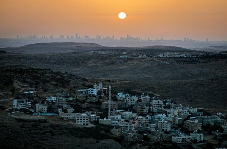 TOPSHOT – A picture taken from the Israeli settlement of Naale in the occupied West Bank northwest of the Palestinian city of Ramallah shows the skyline of the Israeli coastal city of Tel Aviv on June 17, 2020. – The government of Israeli Prime Minister Benjamin Netanyahu has said it could begin  the process to annex Jewish settlements in the West Bank as well as the strategic Jordan Valley from July 1. The plan — endorsed by Washington — would see the creation of a Palestinian state, but on reduced territory, and without Palestinians’ core demand of a capital in east Jerusalem. (Photo by MENAHEM KAHANA / AFP) (Photo by MENAHEM KAHANA/AFP via Getty Images)