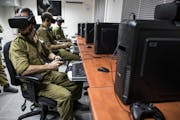 Israeli special combat soldiers conduct a training exercise using virtual reality (VR) battlefield technology to simulate Hamas tunnels leading from Gaza to Israel at an Israeli Army base in Petach Tikva, Israel, on Wednesday, April 26, 2017. In a refurbished building on a military base in central Israel, soldiers are training in underground combat using headsets made by Oculus, the virtual reality headset maker owned by Facebook Inc., and Vive, owned byHTC Corp. Photographer: Rina Castelnuovo/Bloomberg via Getty Images